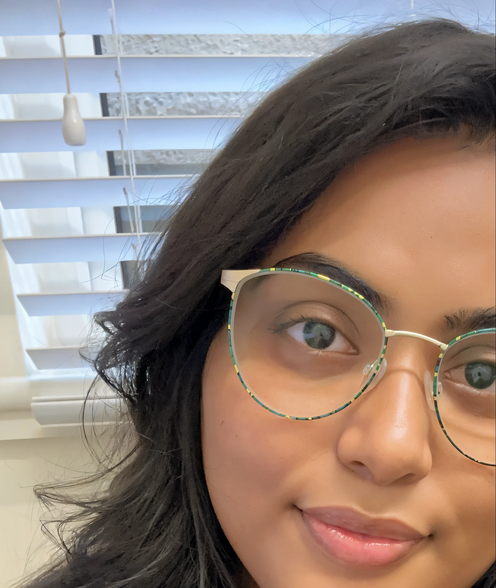 there is a woman with glasses sitting at a table with a donut, wavy long black hair and glasses, girl wearing round glasses, wearing small round glasses, profile image, wearing thin large round glasses, she wears harry potter glasses, with glasses, wearing lab coat and glasses, wearing black rimmed glasses, profile picture, mia khalifa, thick glasses, !!wearing modern glasses!!