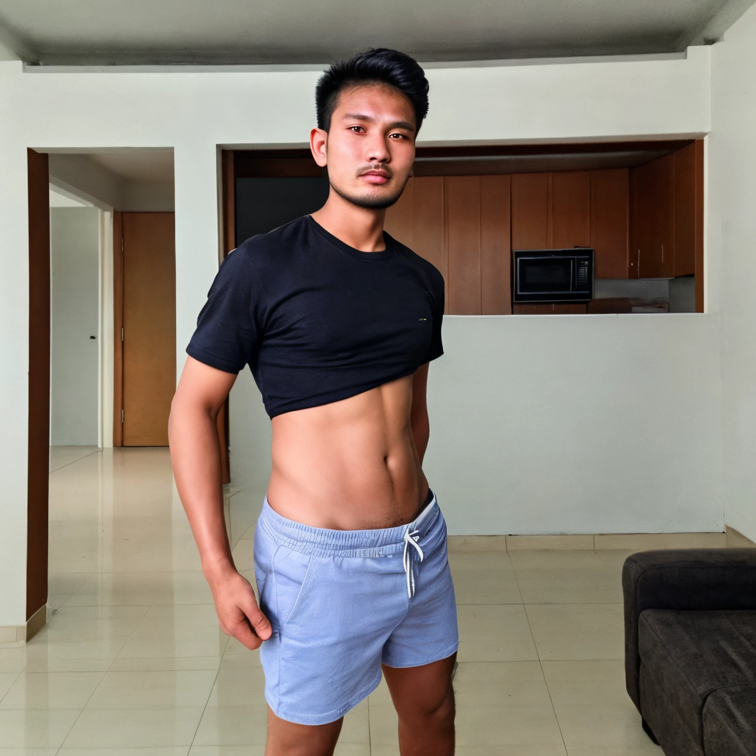 Cambodia man , instagram model, facial hair, standing up , shorts, apartment