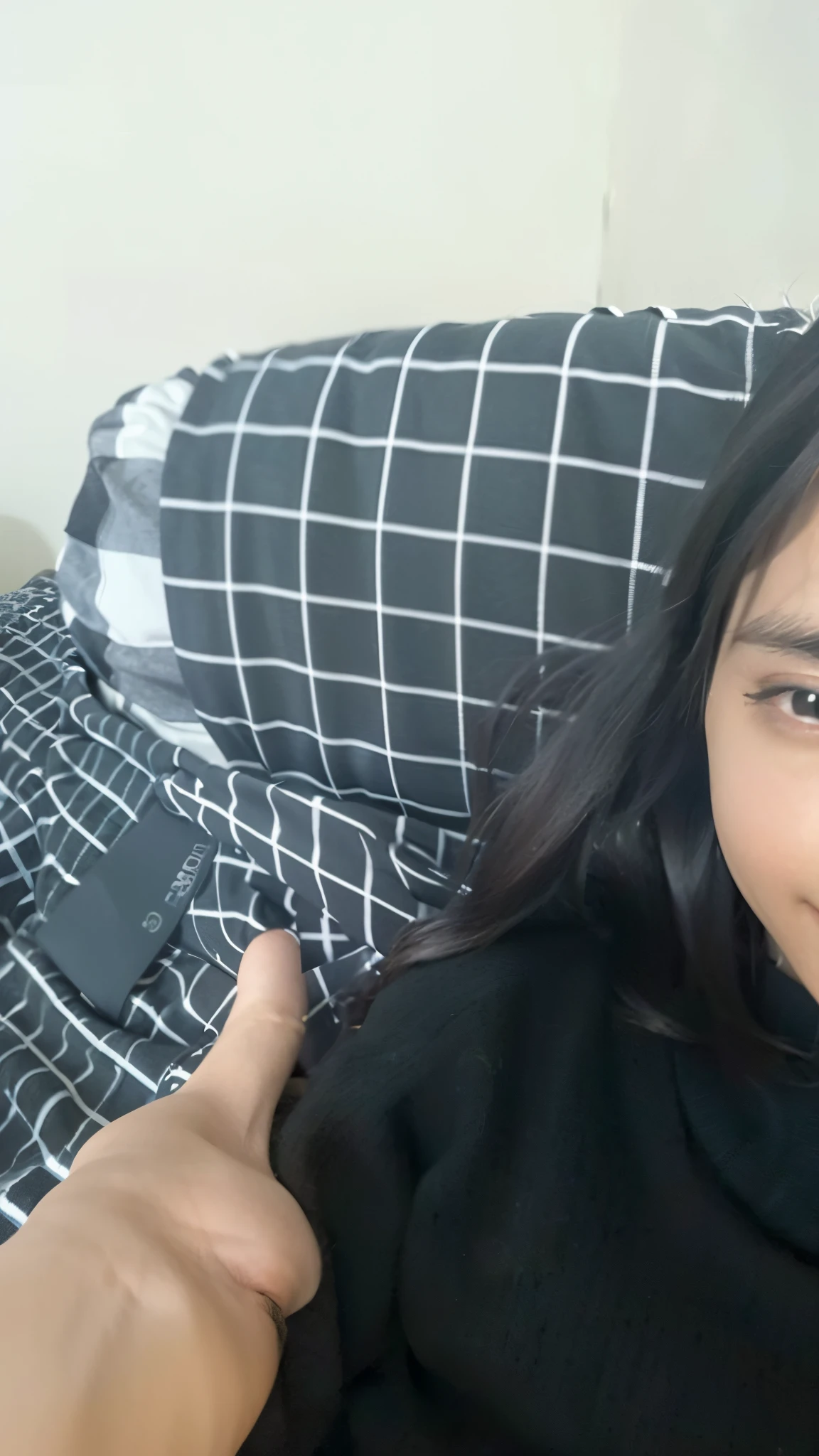 there is a woman sitting on a couch with a black shirt, on my bed, selfie!!!!!, desaturated!!, selfie photo, posing in bed, friedly smile, satisfied pose, bored, black and white picture, with long hair, sitting on the bed, with straight black hair, monochrome!!!!!, selfie shot straight on angle, lying in bed