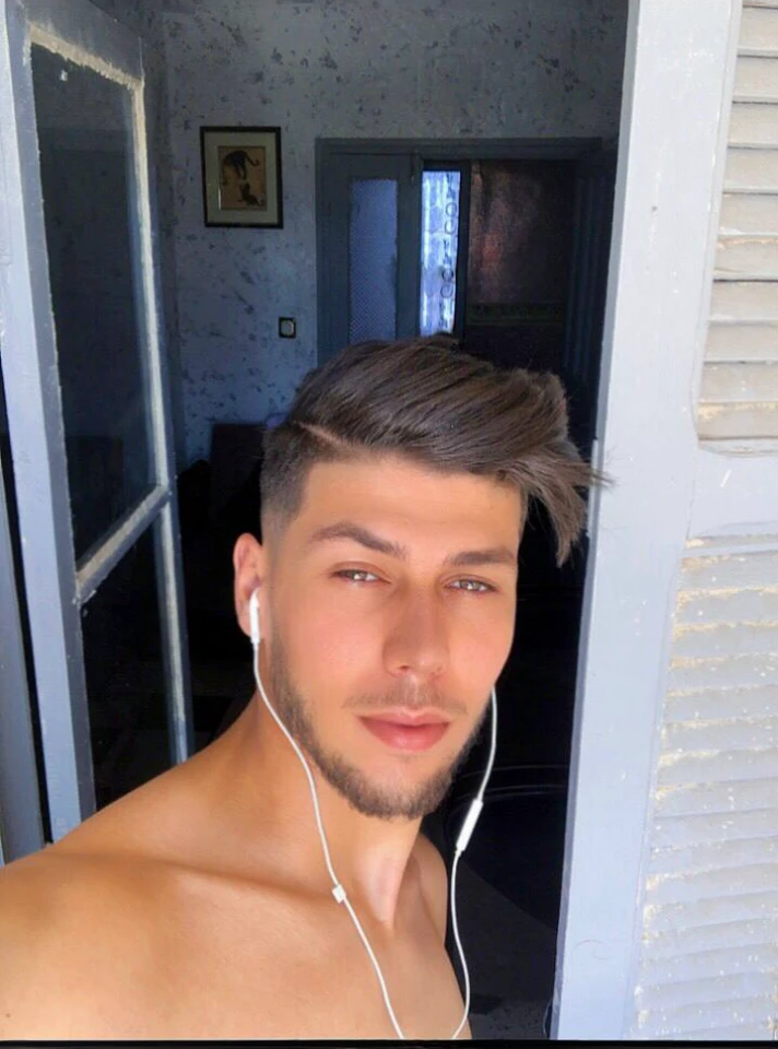 there is a man with ear buds on his head and a shirtless man with earphones, young greek man, perfect face and boy, perfect handsome face, perfect face ), handsome face and beautiful face, handsome face, young spanish man, attractive and good looking, lean man with light tan skin, handsome attractive face, beautiful young man, attractive face, attractive male, cute young man