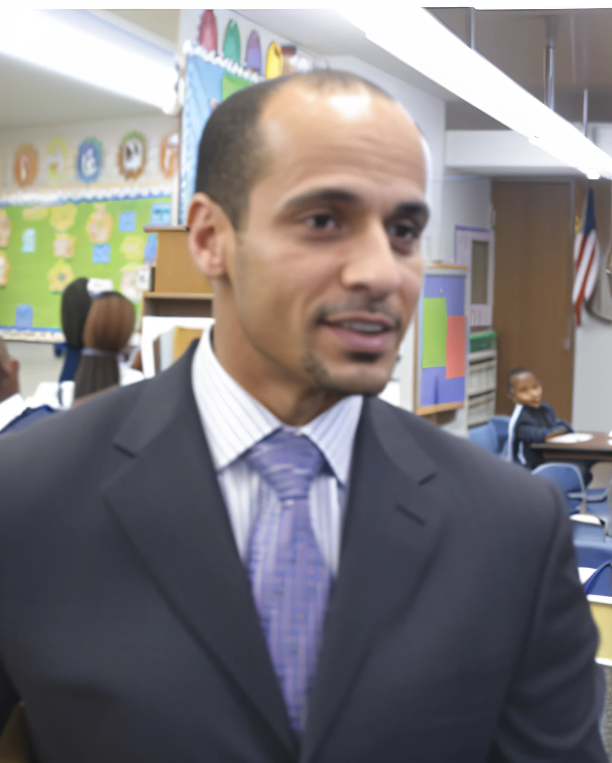 arafed man in a suit and tie in a classroom, smooth in the background, news reporter anthony conn, smooth in _ the background, ariel perez, jemal shabazz, richard sigamani, richard taddei, schools, ted nasmit, full subject shown in photo, mario martinez, michael pangrazio, great likeness, smug look, dan mora
