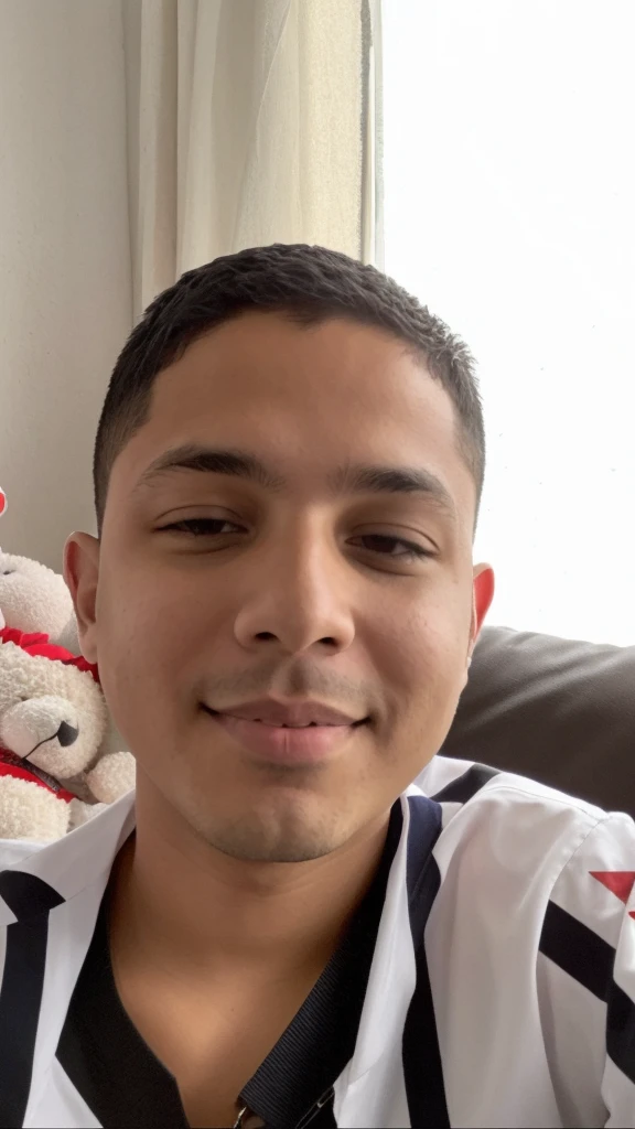 There's a boy sitting on a couch with a stuffed animal, Riyahd Cassiem, menino com rosto neutro, taken in the early 2020s, menino tem cabelo preto curto, 1 6 anos, Reyyan, imagem do rosto, rosto raspado, menino novo, 18 anos, Jose Miguel Romano Francisca, Condutor de Ene