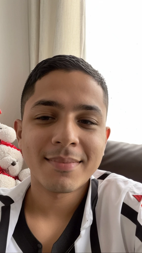 There's a boy sitting on a couch with a stuffed animal, Riyahd Cassiem, menino com rosto neutro, taken in the early 2020s, menino tem cabelo preto curto, 1 6 anos, Reyyan, imagem do rosto, rosto raspado, menino novo, 18 anos, Jose Miguel Romano Francisca, Condutor de Ene