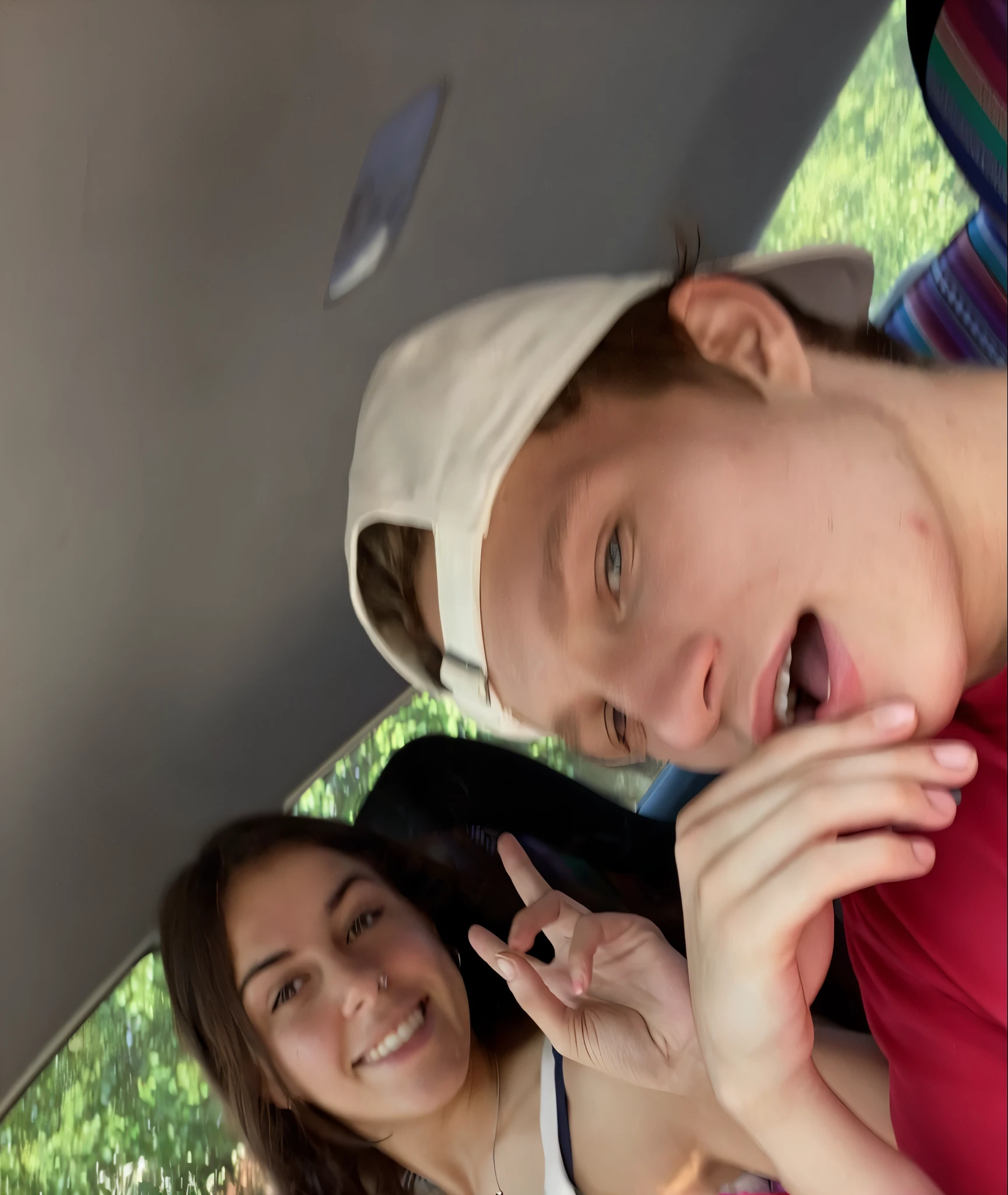 there are two people sitting in the back of a car, very very low quality picture, on a parking lot, giving the middle finger, charli bowater and artgeem, low quality photo, very excited, very silly looking, accidentally taking a selfie, holding it out to the camera, sitting in her car, taken with the best dlsr camera