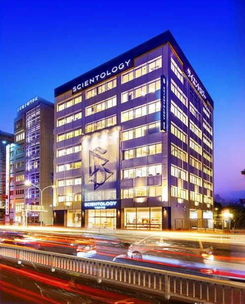 Arafed image of a large building with a clock, discovered photo, scientific, Scientific picture, postprocessed), exterior shot, 1505, high quality photograph, trending photo, riverside, photoshot, arhitectural shot, exterior wide shot, scientist, Office, highres photograph, 2070, modern technology building