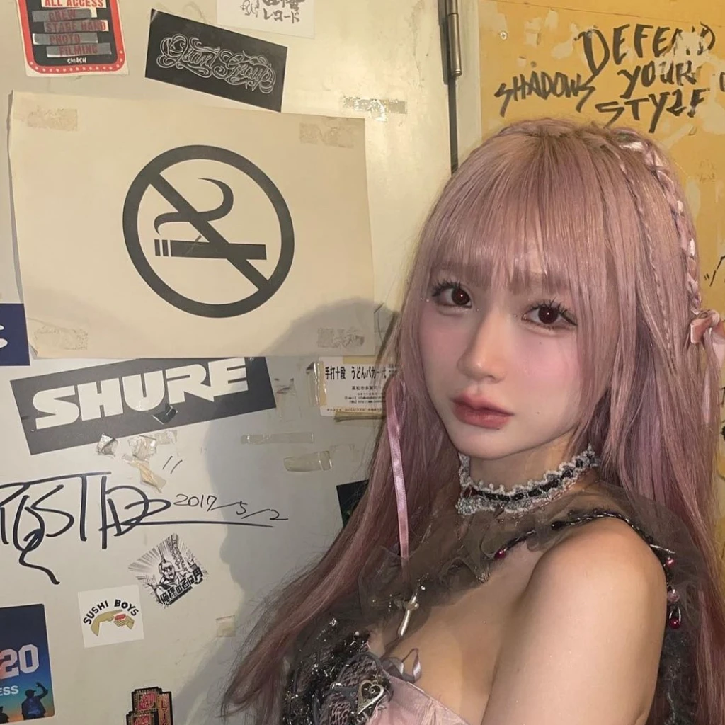 Arafi girl with pink hair and wearing a pink top poses for a photo, Belle Delphine, hime-cut, chiho, e-Girl, e - girl, fairycore, With pink hair, shikamimi, pink twintail hair and cyan eyes, harajuku hair, pink straight hair, rena nounen style 3/4