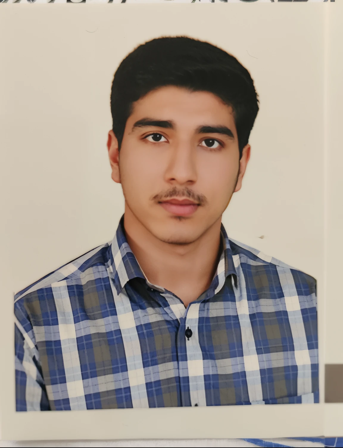 arafed picture of a man with a mustache and a plaid shirt, khyzyl saleem, ash thorp khyzyl saleem, around 1 9 years old, very very low quality picture, sayem reza, mohamed chahin, portait photo profile picture, riyahd cassiem, kyza saleem, emad mostaque