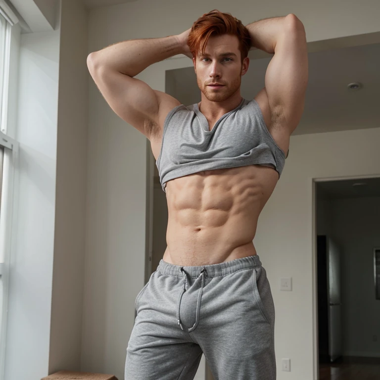 Redhead man, shirtless, wearing grey sweatpants with a huge bulge in his sweatpants,
