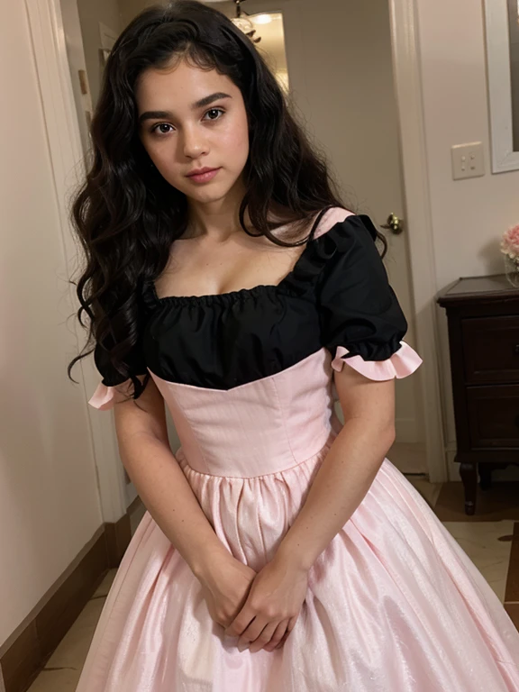 Tween girl with curly-wavy black hair wearing a light pink royal gown