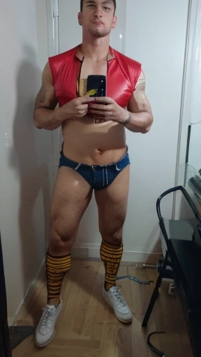 A sexy handsome male escort gets ready to go to the clubs and try to make money. His shorts are ruby red denim shorts.