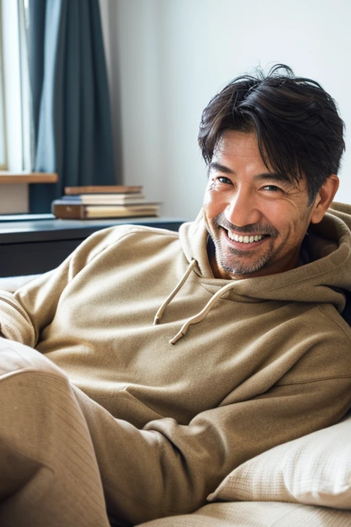 Looking at the smartphone and smiling,Handsome Japan,man in his 50's,I have a smartphone,wearing hoodies,Have a tan,lying on a futon in the room,White Room