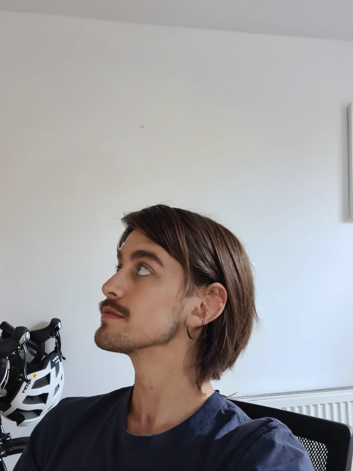 Medium length hair, trimmed back and sides but not shaved