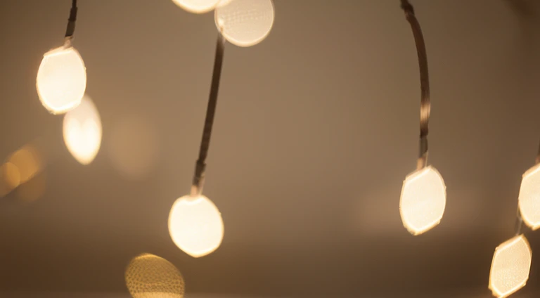 a detail shot of a softly lit, abstract bokeh pattern, showcasing the delicate and sparkling lights as a soft and magical background.