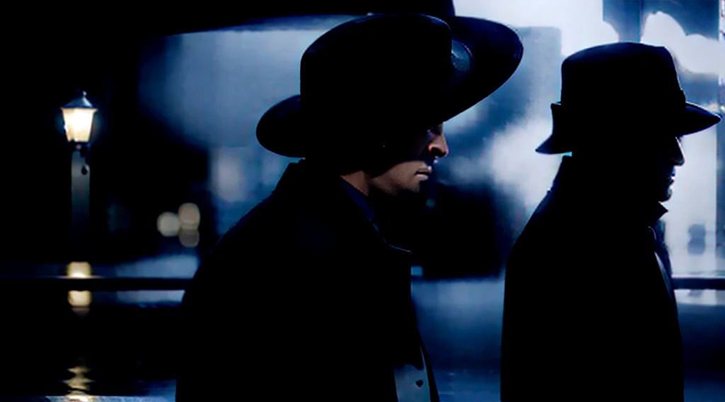 /imagine prompt: Realistic, personality: [A heavy rain pouring down, revealing the silhouette of a man wearing a black coat and hat, holding an umbrella, standing in front of a bank. The rain should be visible, hitting the ground and creating puddles. The man's face and body should be partially obscured by the rain, adding an air of mystery and intrigue. The black coat and hat should be clearly visible, emphasizing his stealthy and enigmatic presence. The umbrella should be partially open, with raindrops clinging to it. The bank should be in the background, partially illuminated by the streetlights, giving it a dark and foreboding atmosphere] unreal engine, hyper real --q 2 --v 5.2 --ar 16:9