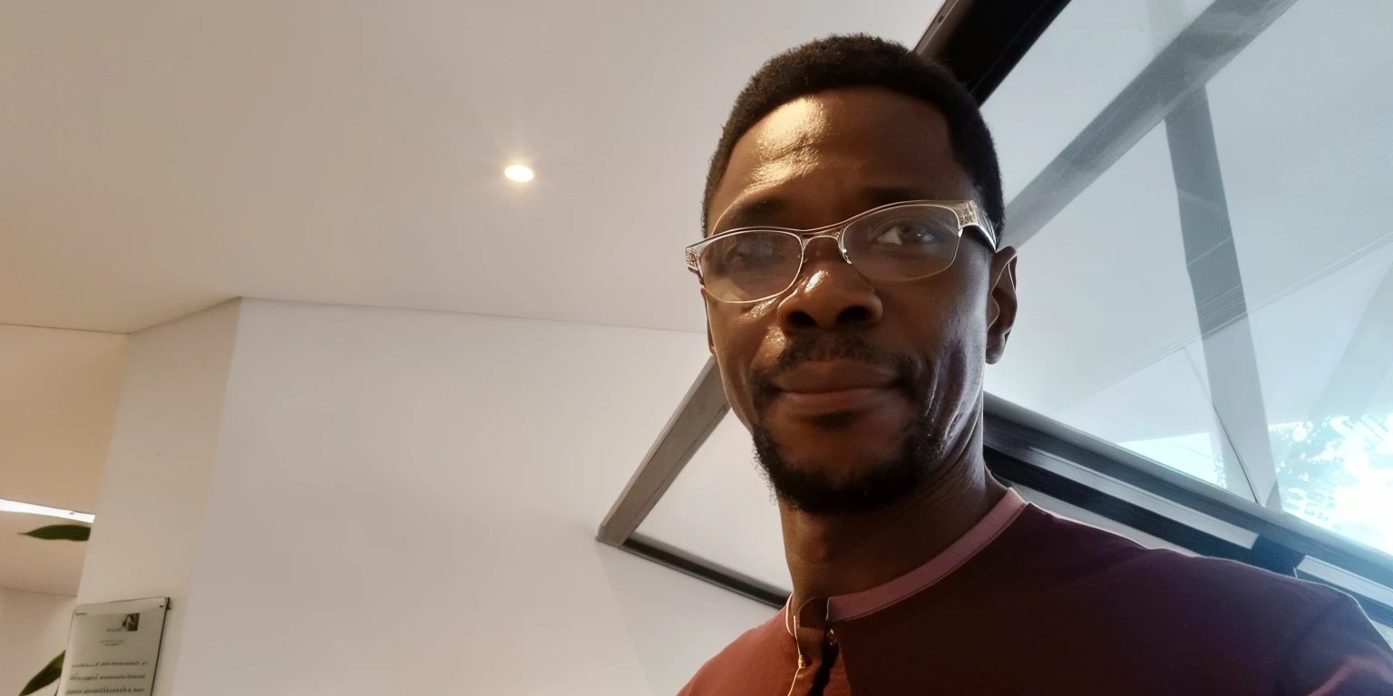 there a man wearing glasses and a red shirt, adebanji alade, 3 6 years old, 3 2 years old, 38 years old, 2 9 years old, david uzochukwu, 3 5 years old, 35 years old, about 3 5 years old, 2 7 years old, 8k selfie photograph, 2 8 years old