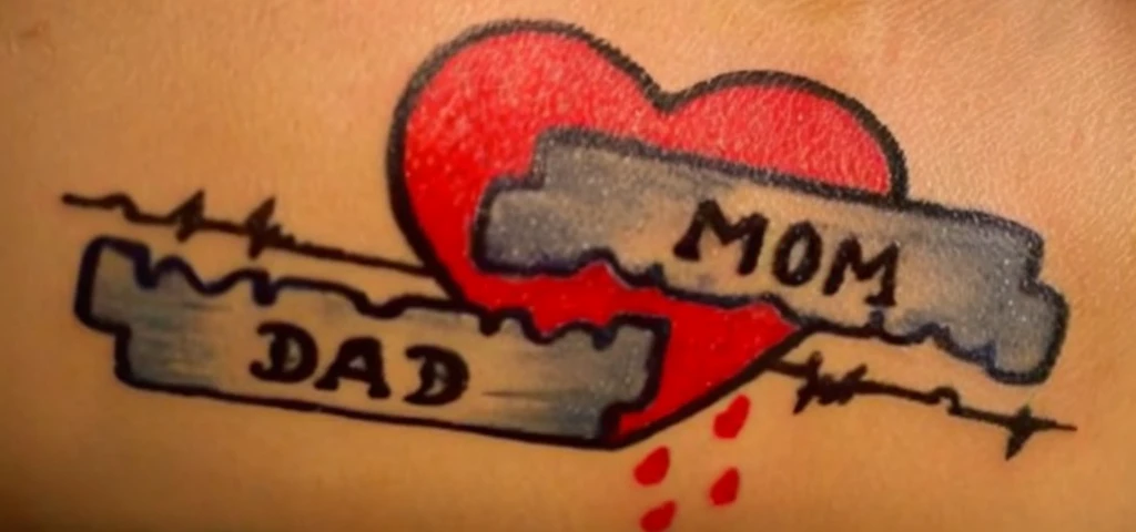 a brazilian woman with a tattoo of a heart with a broken piece of , a tattoo, traditional tattoo, traditional ink!, traditional ink, temporary tattoo, award winning tattoo, tatto, tattoo stencil, tattoo ink, heart emblem on chest, lsd tattoo design, whole tattoo, sad motif, more details, tatoo, added detail, inking on skin, tattoo