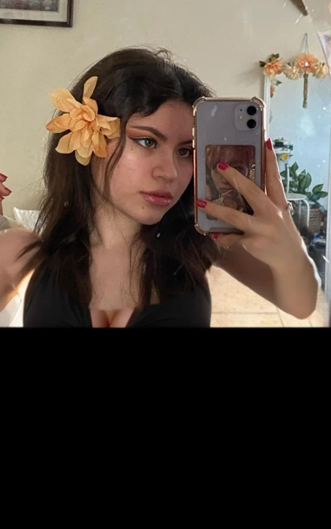 there is a full body of a woman taking a picture of herself with her cell phone, very very low quality picture, flower in her hair, headshot profile picture, selfie of a young woman, low quality photo, lily frank, her face looks like an orchid, Big , huge , no clothes, sexy, cute, minimal clothes, thick, bbw, chubby stomach, thick nipples, nipple piercings, large areola, hard nipples, piercing through shirt, nipples hard through shirt, busty, major cleavage, naked, ripping through top, spilling over sides, bra too tight, giant , extra wide hips, upper body zoom in, showing off huge , fat stomach, see through top, fat bbw, large areola showing, major cleavage, latina, down to stomach, wide hips, sexy, upper body zoom, showing off , top half only, showing only upper, showing off cleavage, shown down to hips, extended background, no empty space in background, fill all pixels, nude girl in bedroom, wearing only a bra, background extended, upper body only in whole picture