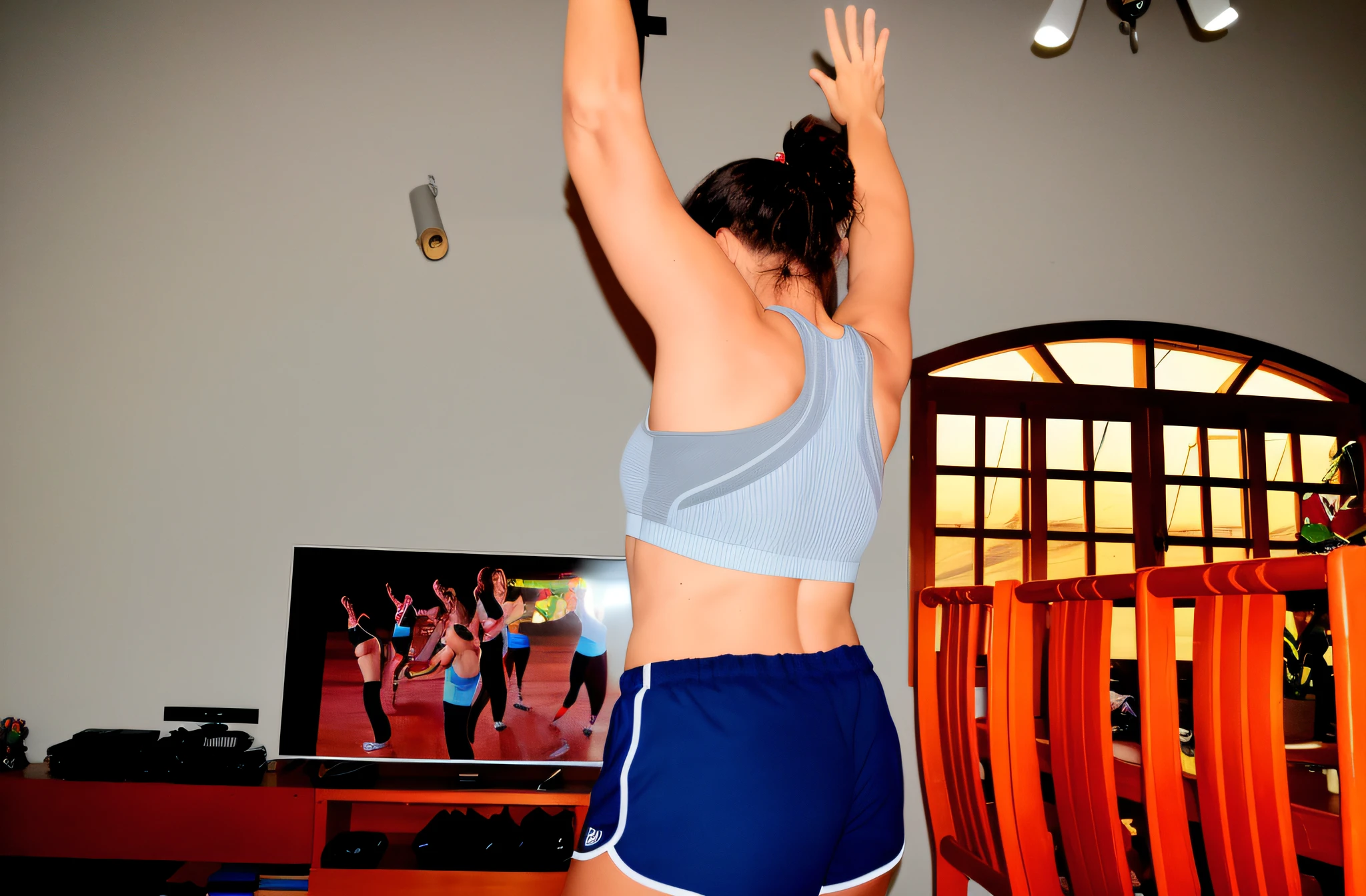 there is a woman who is playing with a remote control, sport bra and dark blue shorts, with arms up, Cottagecore!! corpo fitness, by Gina Pellón, dancing in the background, by Amelia Peláez, Costas - Pneu, malhar, leaping with arms up, tiro nas costas, Back from Toned, sport bra and shorts