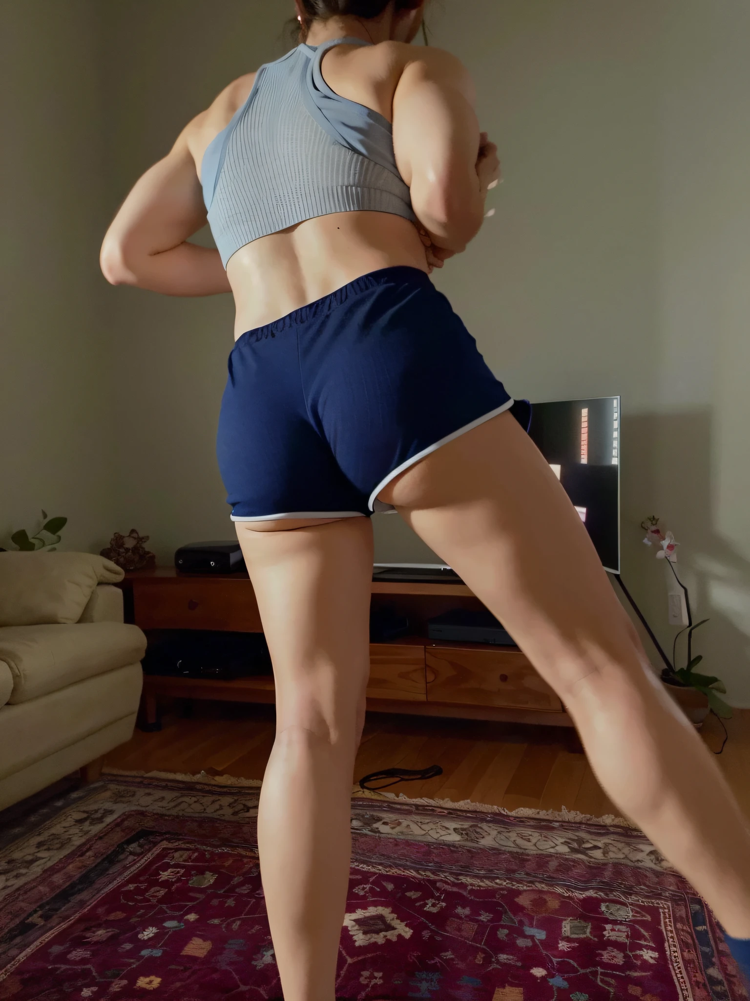 araffe woman in blue shorts and gray blouse standing on a rug, Bermuda, tiro longo das costas, tiro longo de costas, sport bra and dark blue shorts, Shot from behind, view from behind, seen from back, from the back, very short pants, view of the back, legs and arms, picture from behind, from the back