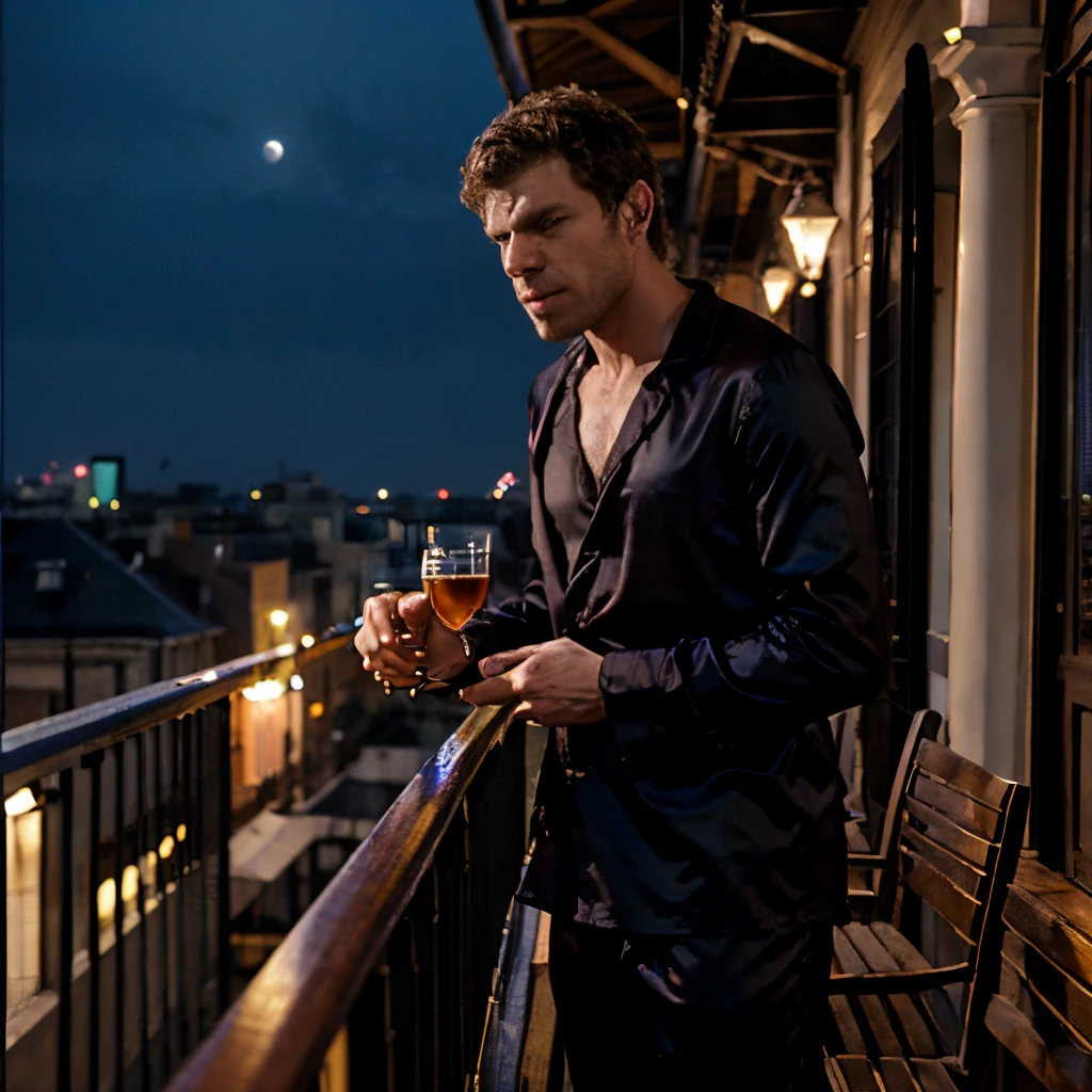 Joseph Morgan wearing nothing but black silk pajama pants standing on the balcony of the french quarter of New Orleans under a full moon drinking his favorite glass of bourbon
