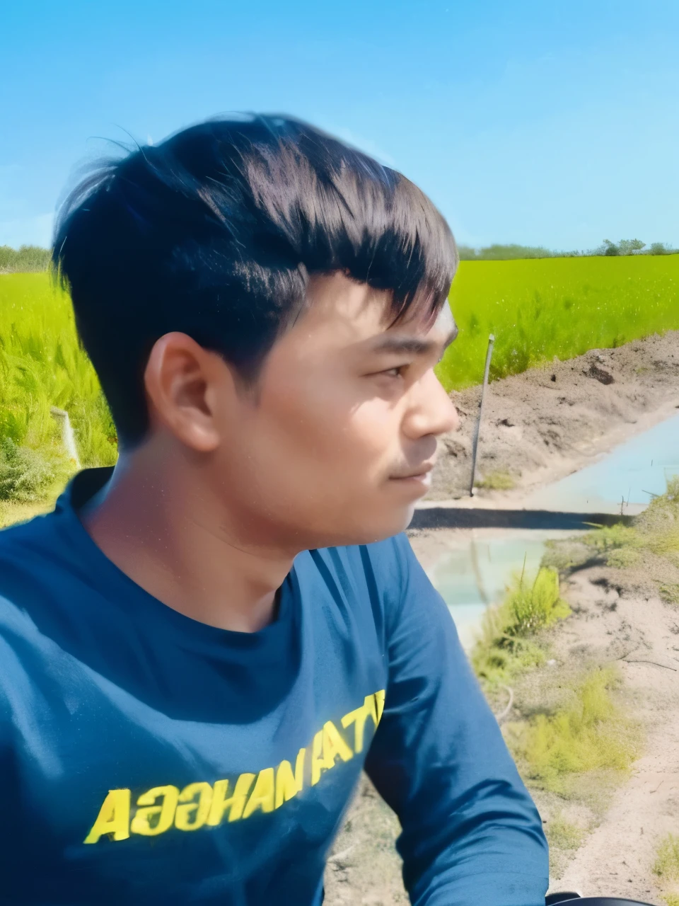there is a man riding a motorcycle down a dirt road, thawan duchanee, profile pic, 4 0 years old man, south east asian with round face, single bangla farmer fighting, nivanh chanthara, picture, very very low quality picture, ramil sunga, uploaded, potrait, profile shot, 2 7 years old