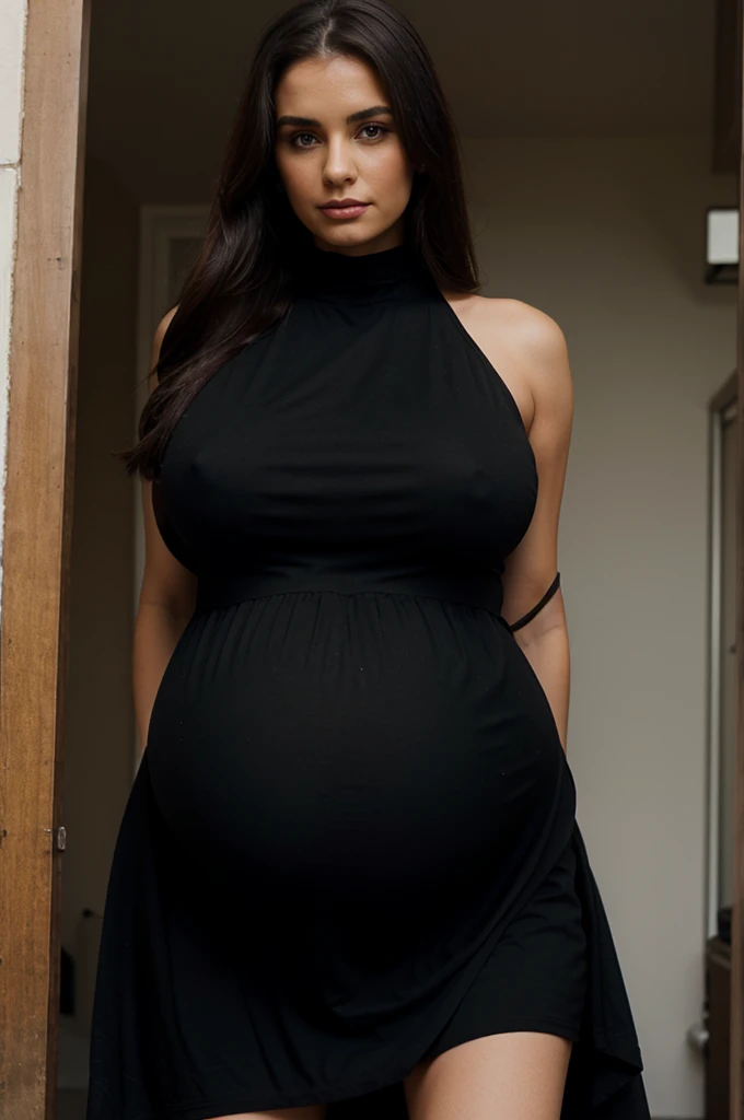 Pregnant woman with large breasts, in a long black beautiful dress