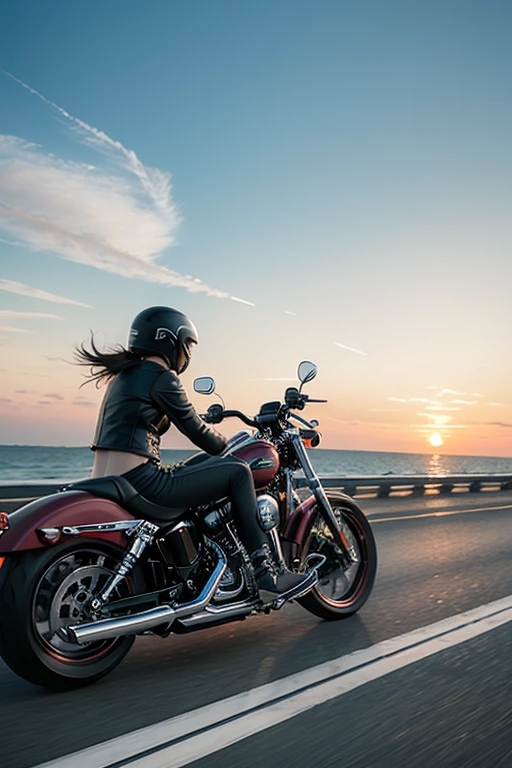 A Harley motorcycle is cruising on the highway, by the seaside, during sunset, capturing a sense of speed.