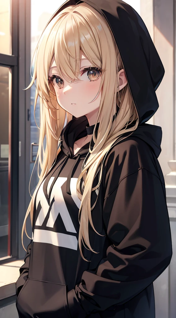 A Beautiful Young Woman with sun dappled skin Dirty Blonde hair and Deep Brown eyes wearing a black hoodie