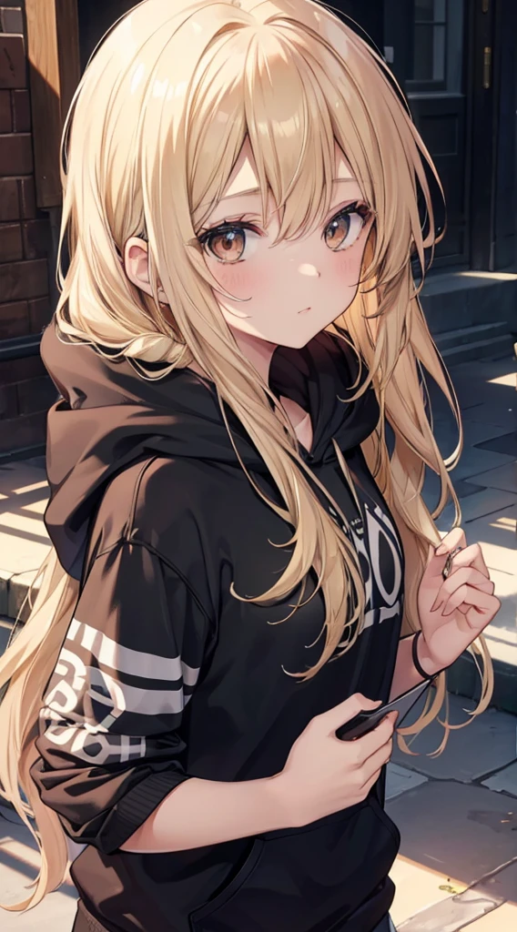 A Beautiful Young Woman with sun dappled skin Dirty Blonde hair and Deep Brown eyes wearing a black hoodie