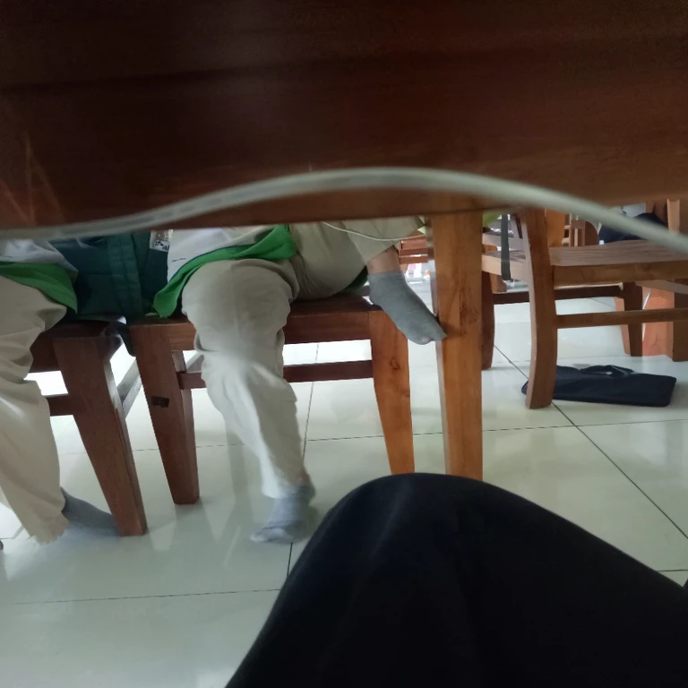 there are two people sitting at a table with their feet on the table, sitting at table, sitting at a table, sitting on the table, sitting at the table, sitting on a table, detailed shot legs-up, detailed legs looming over you, green legs, legs visible, legs replaced with human legs, perspective shot, legs intertwined, open legs, naked