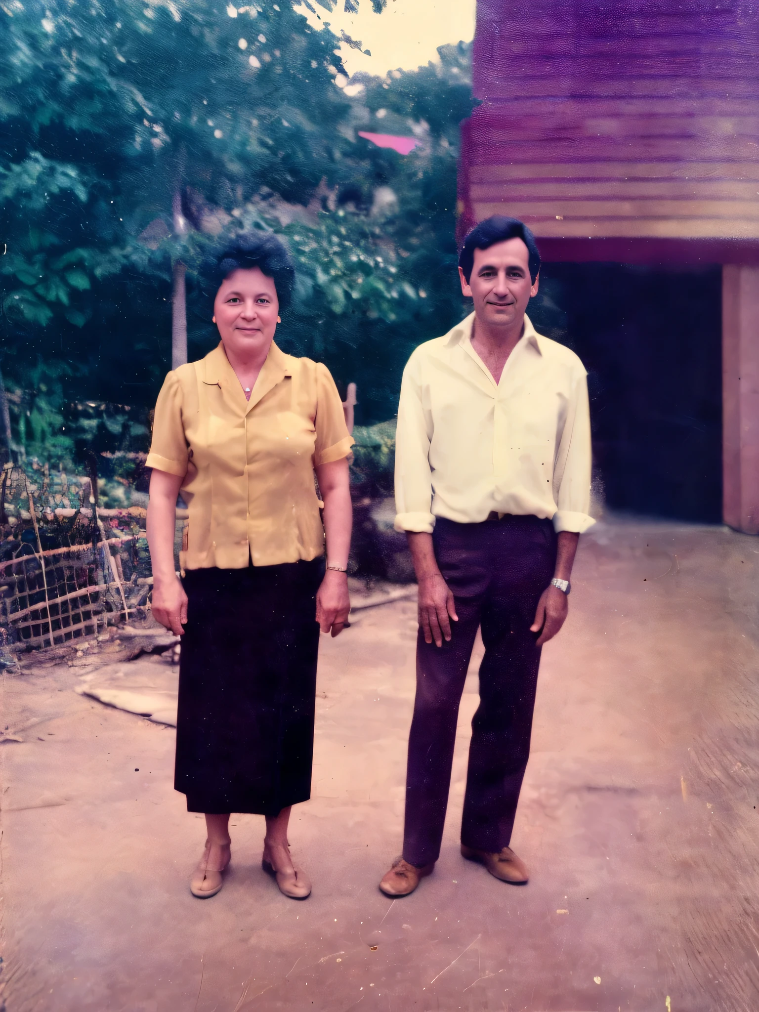 there are two people standing in front of a building, momma and papa, couple, old style photo, old photo, 1980s photo, 1 9 8 0 s photo, old picture, grainy vintage, analog photo, colored photo, aged photo, old color photo, portrait of two people, 1970s photo, 7 0 s photo