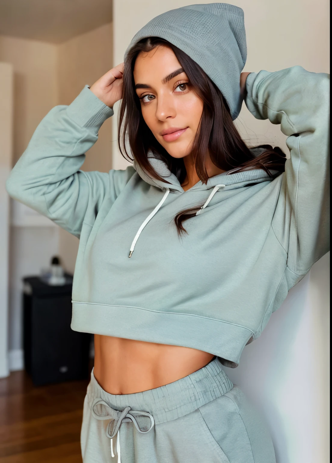 Relaxing at home, minimal style home decor, wearing a grey beanie, grey sweat pants and a hoodie, 26 years old, wavy dark hair, very detailed, light eyes, light green eyes, high-res, materpiece, best quality, intricate details, sharp focus, detailed skin, realistic skin texture, detailed eyes, professional, 4k, canon shooting, perfect fit body, extremely detailed, photo realistic, real life, photo taken from at least 30 feet away, no people in the background, high aperture photo