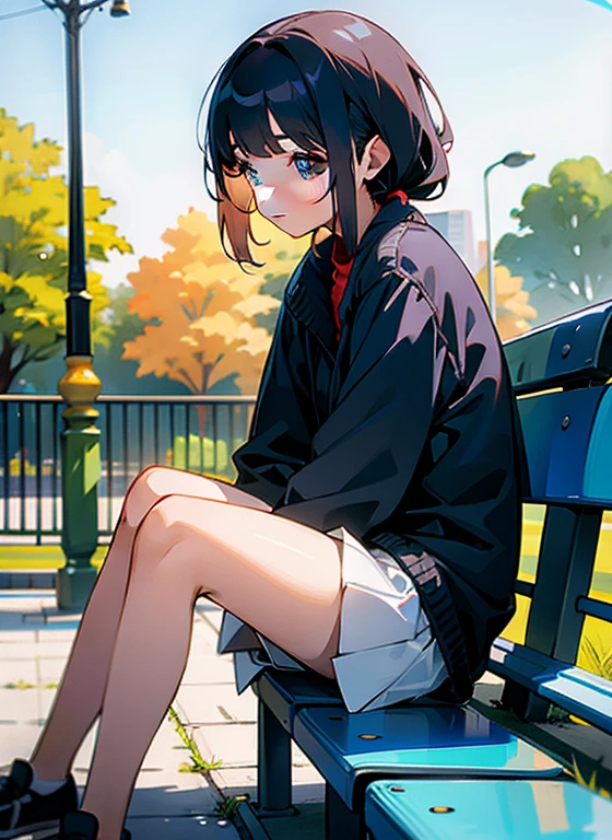The girl is sitting on a park bench.