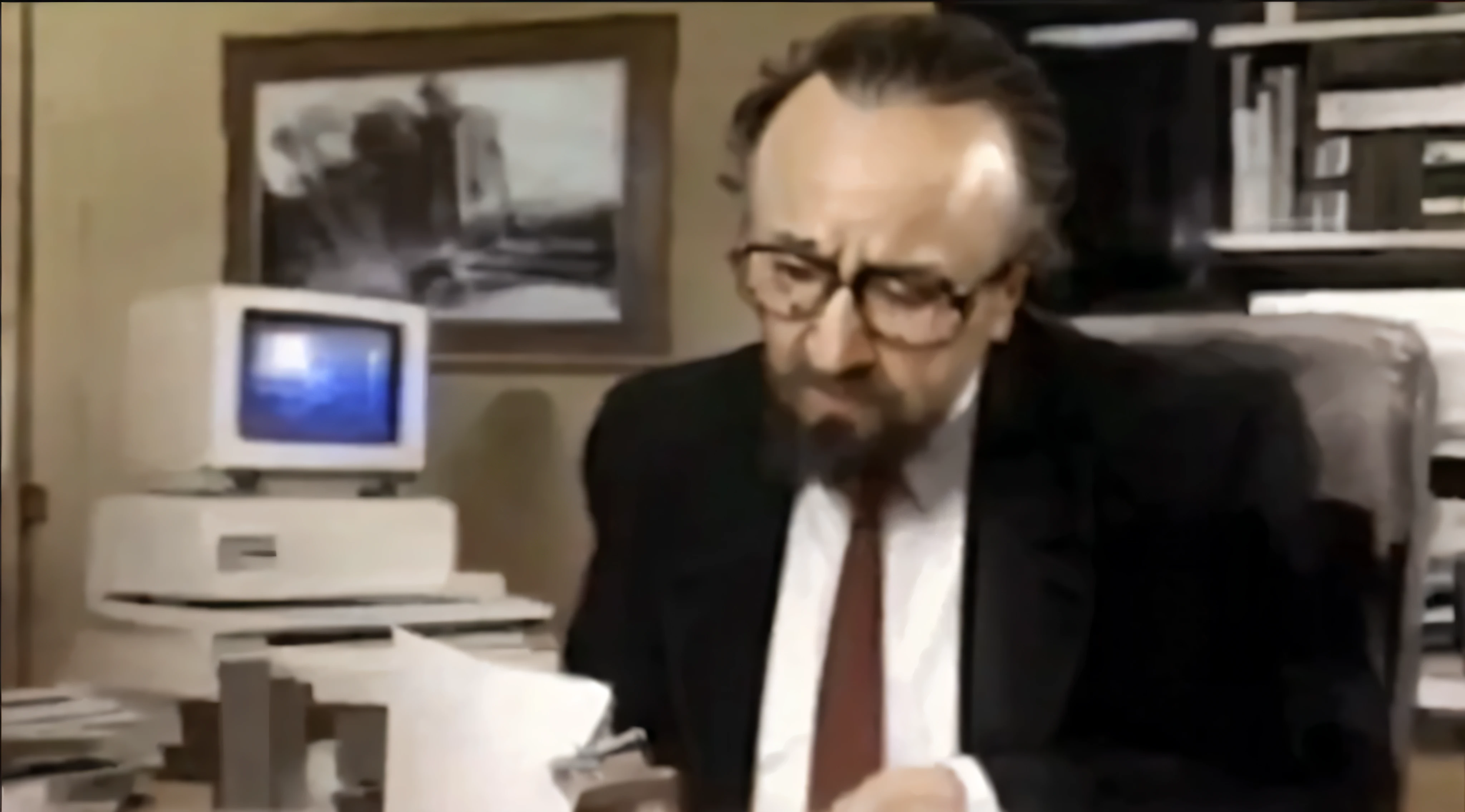 There is a man in a suit sitting on the chair, 1985年的videotape, video static, msotho, Rupert Murdoch as the Devil, 1 9 8 0 s analog video, old footage, Since 1986, videotape, Rob Schneider is a stapler, Ernest Gary Gygax face