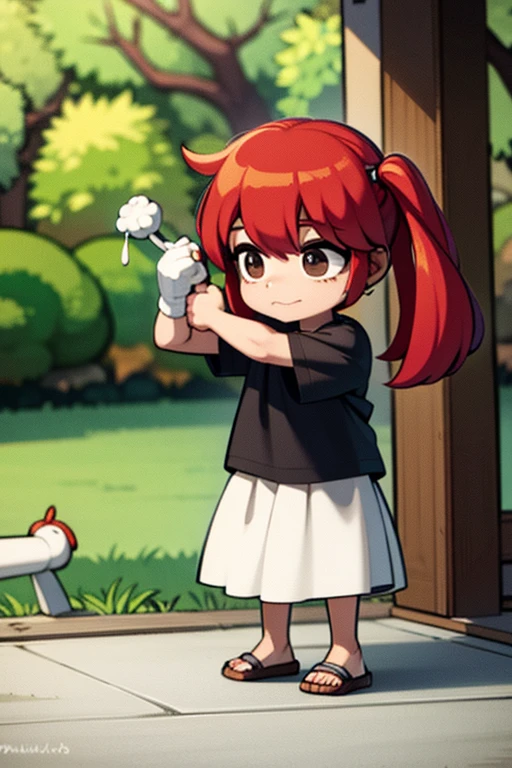 A red haired girl is playing with a toy in front of the tree