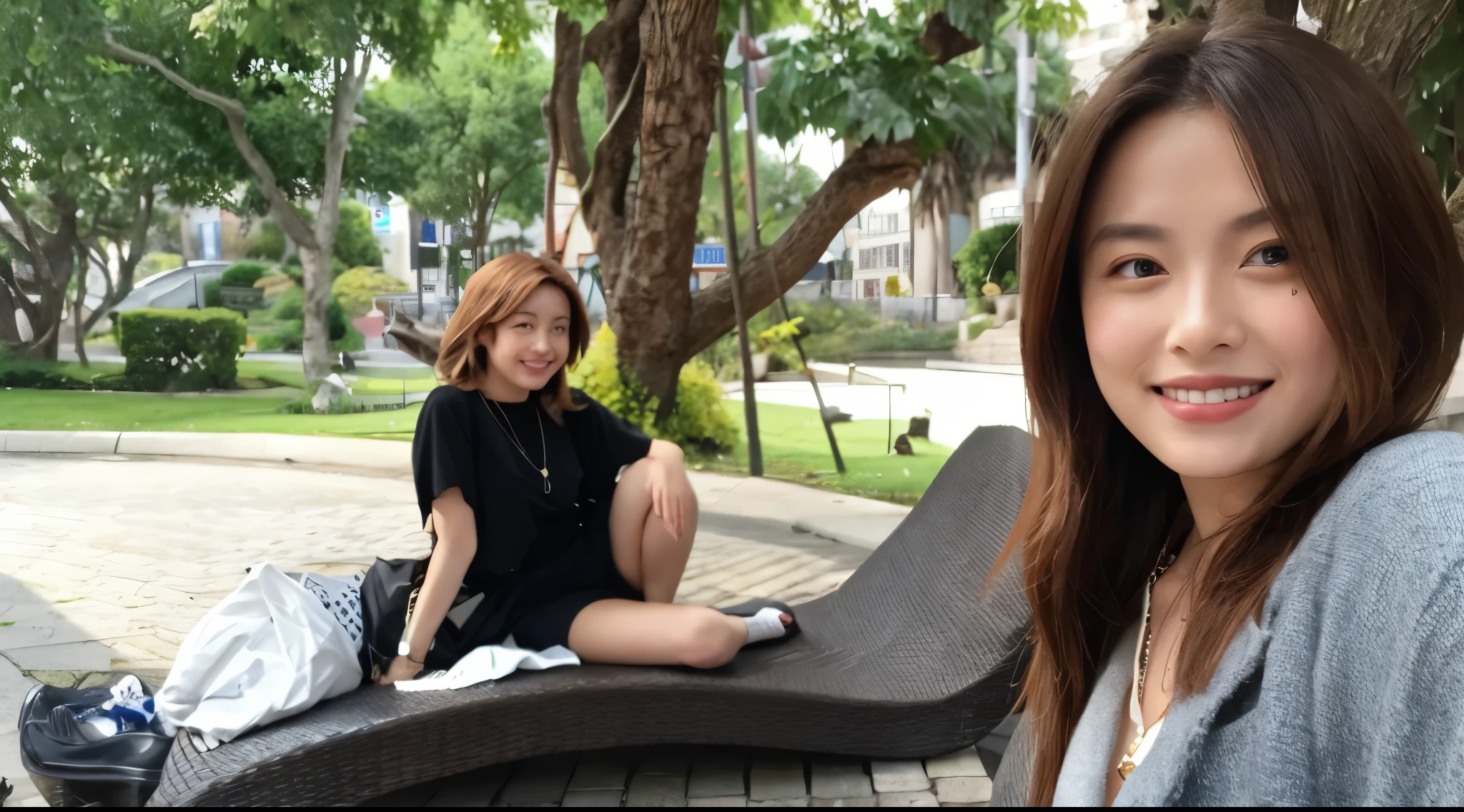 there is two woman sitting on a bench