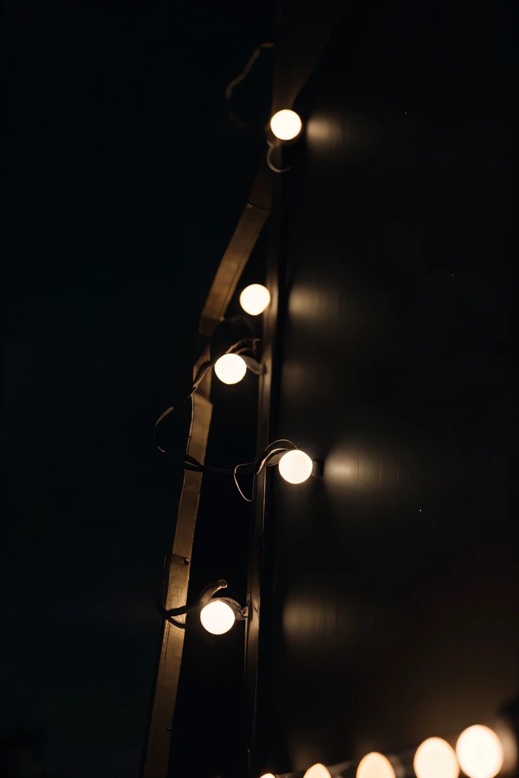 An dark screen iphone wallpaper with christmas lights at the top of the screen