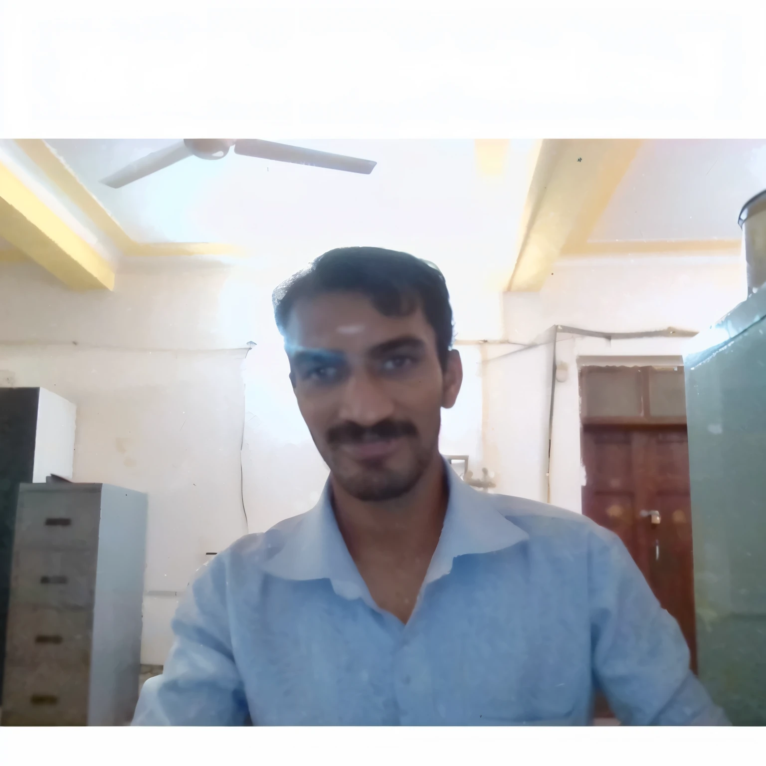there is a man that is standing in a room with a refrigerator, vinayak, very very low quality picture, (38 years old), 4 0 years old man, selfie photo, vastayan, 8k selfie photograph, jayison devadas, with accurate face, low quality photograph, vijay jayant props, full body profile camera shot, selfie!!!!! of a man
