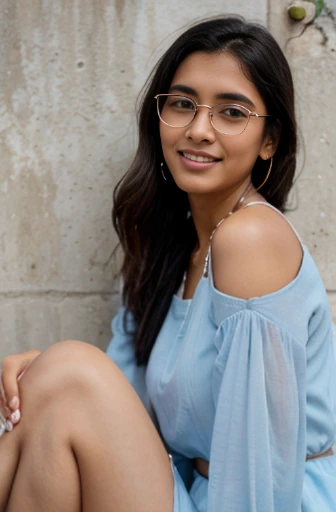 an Indian girl with honey color skin tone, black soft and silky hair till shoulders, wearing a light blue salwar with white borders and white chunni, she is wearing earrings, wearing 2 light colored bangles on each hand, wearing this spectacles, smiling white teeth, rose color lips, happy and excited, pink nail polish, tilting right as if she is talking to someone sitting on the ground slowly, left hand on her left knee, other hand pushing her open hairs behind her right ear revealing a nice earring, realistic, background has walls, on her left is a low wall with pointy fence, behind her is a metal gate and a wall with a ledge to keep flower pots, its evening time, hyper realistic, wide shot, girl is smiling, showing teeth, full body visible