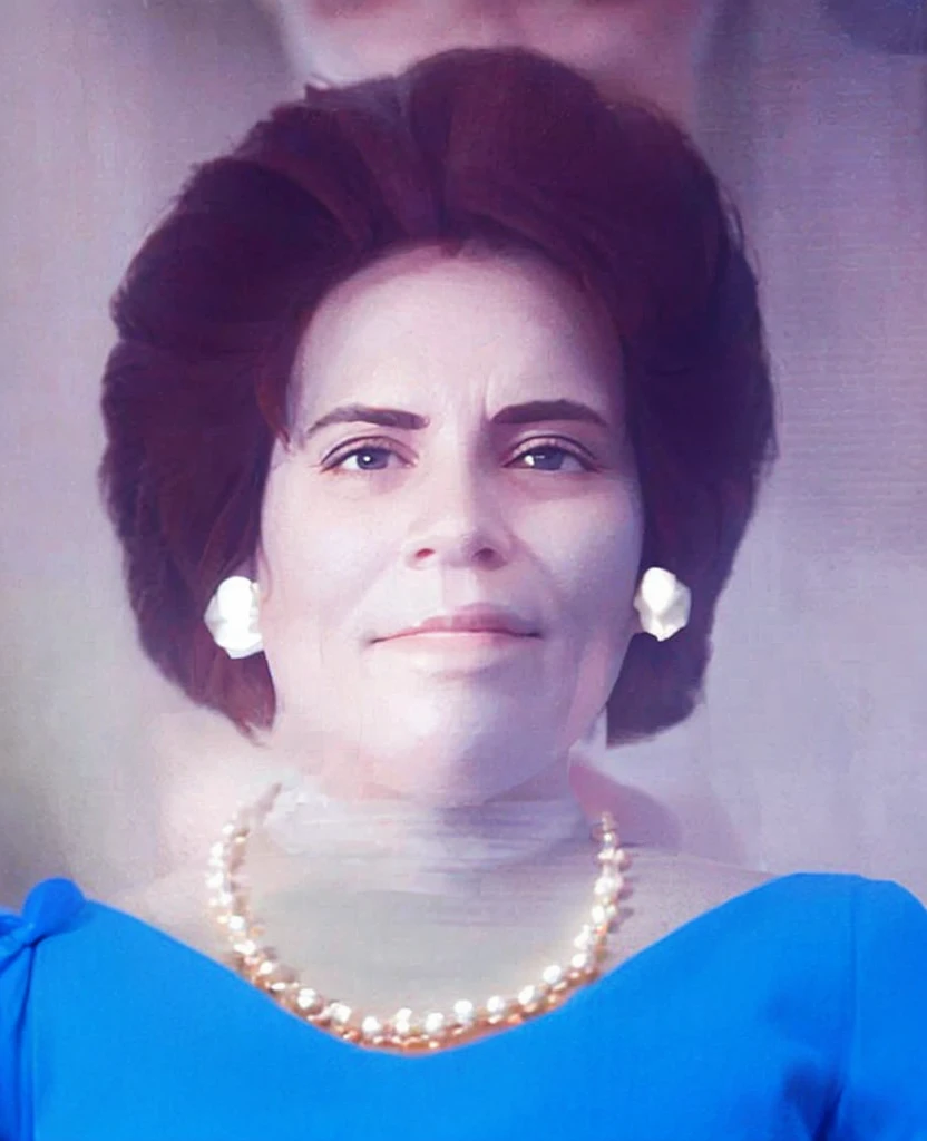 My beautiful grandmother with white bearl set and a blue dress
