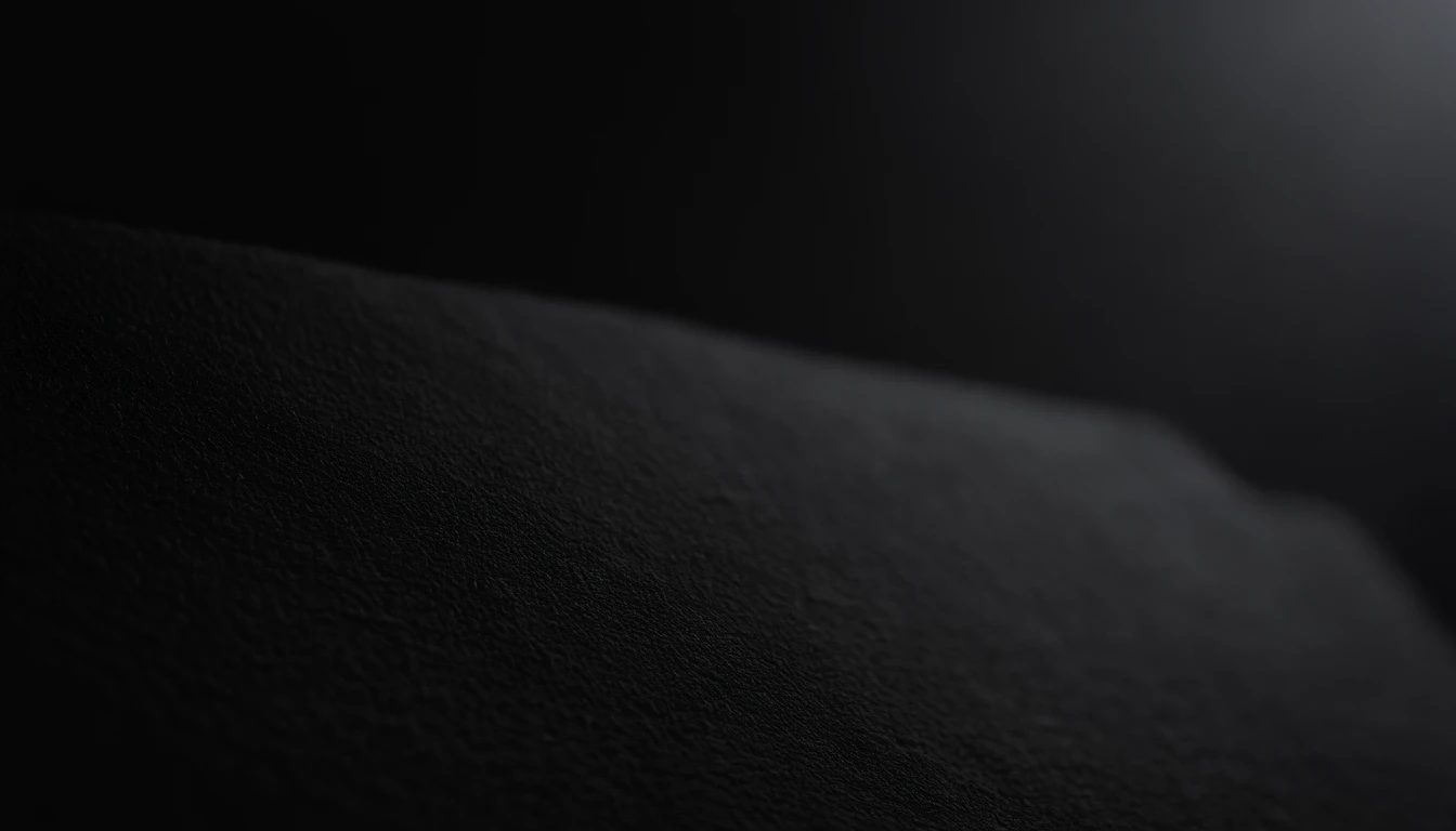 a detailed macro shot of the texture of an empty black wall, focusing on the fine grain and subtle imperfections that give it character and depth