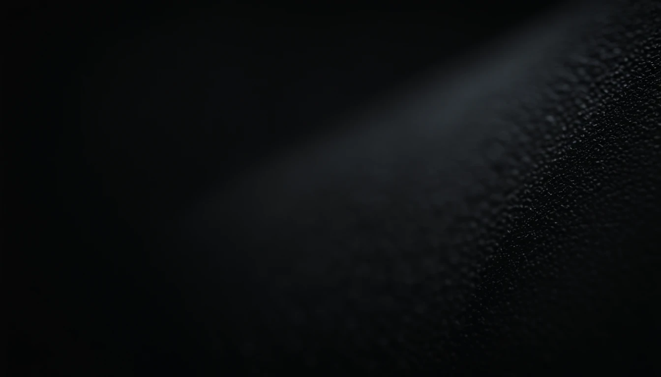 a detailed macro shot of the texture of an empty black wall, focusing on the fine grain and subtle imperfections that give it character and depth