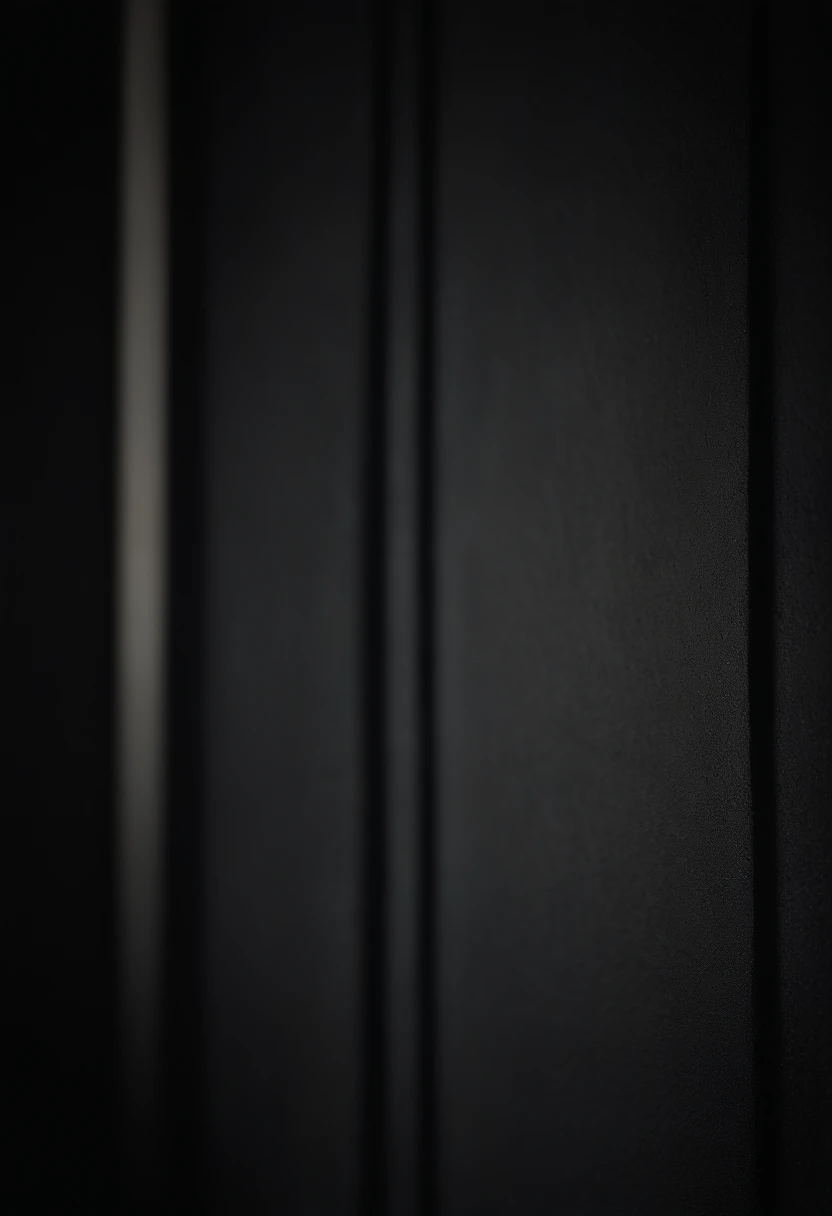 a detailed macro shot of the texture of an empty black wall, focusing on the fine grain and subtle imperfections that give it character and depth