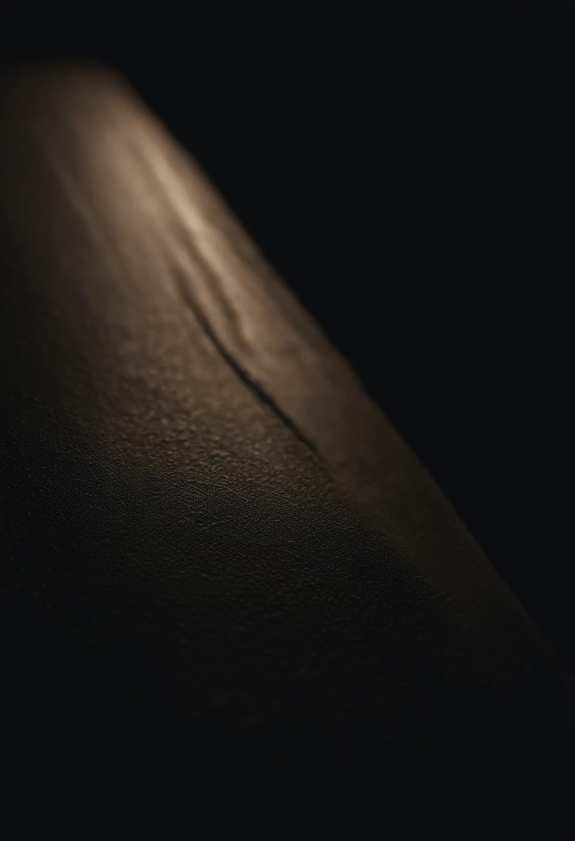 a detailed macro shot of the texture of an empty black wall, focusing on the fine grain and subtle imperfections that give it character and depth