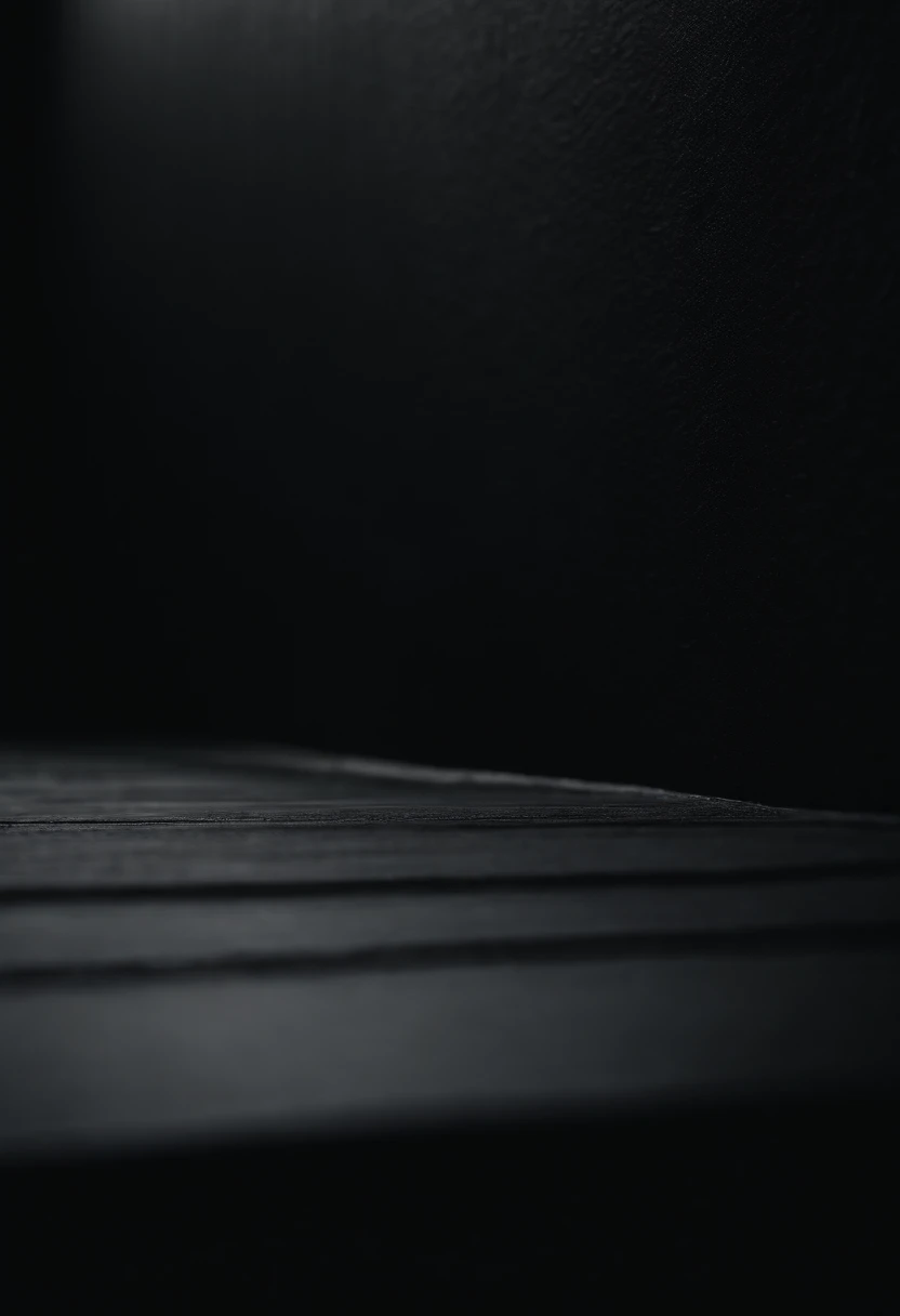 a detailed macro shot of the texture of an empty black wall, focusing on the fine grain and subtle imperfections that give it character and depth