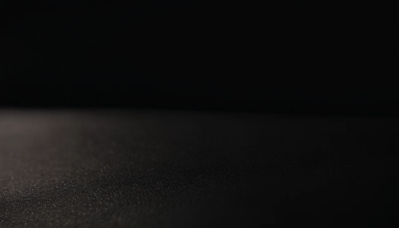 a detailed macro shot of the texture of an empty black wall, focusing on the fine grain and subtle imperfections that give it character and depth
