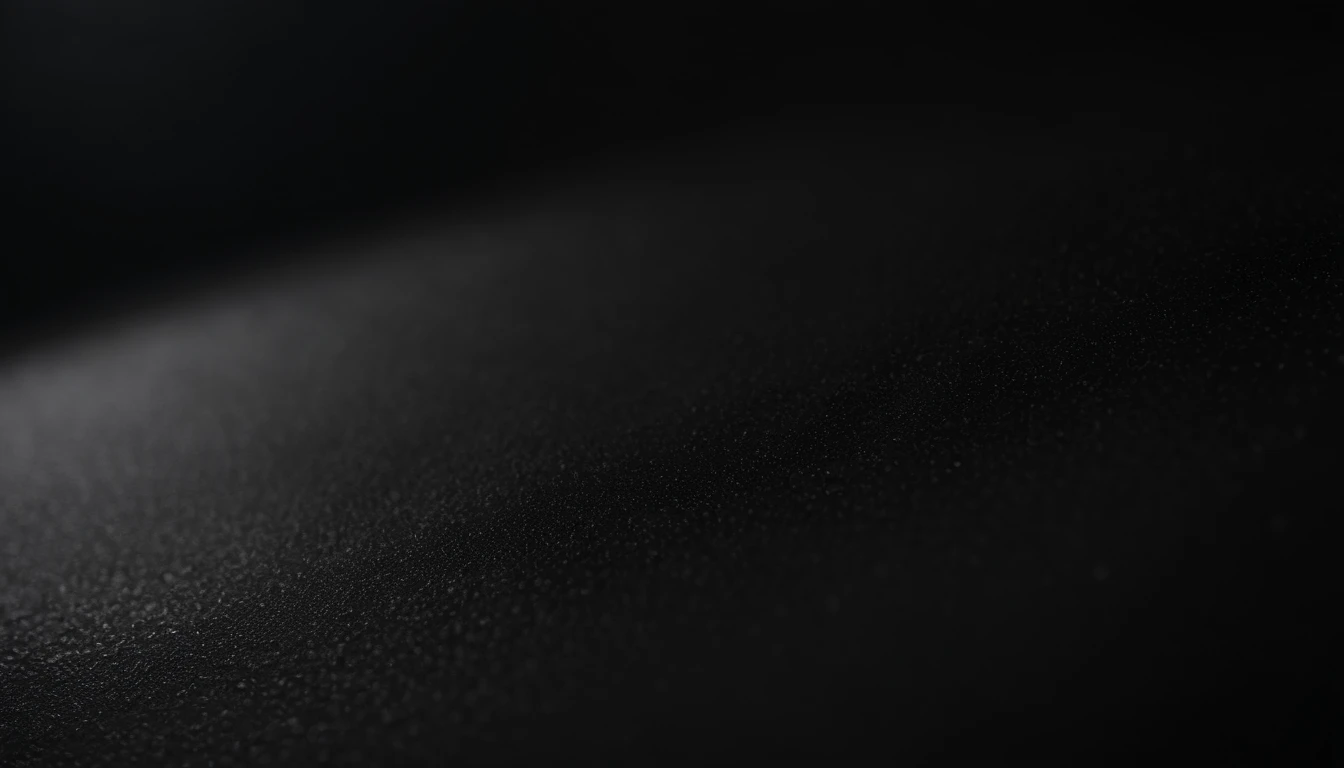 a detailed macro shot of the texture of an empty black wall, focusing on the fine grain and subtle imperfections that give it character and depth