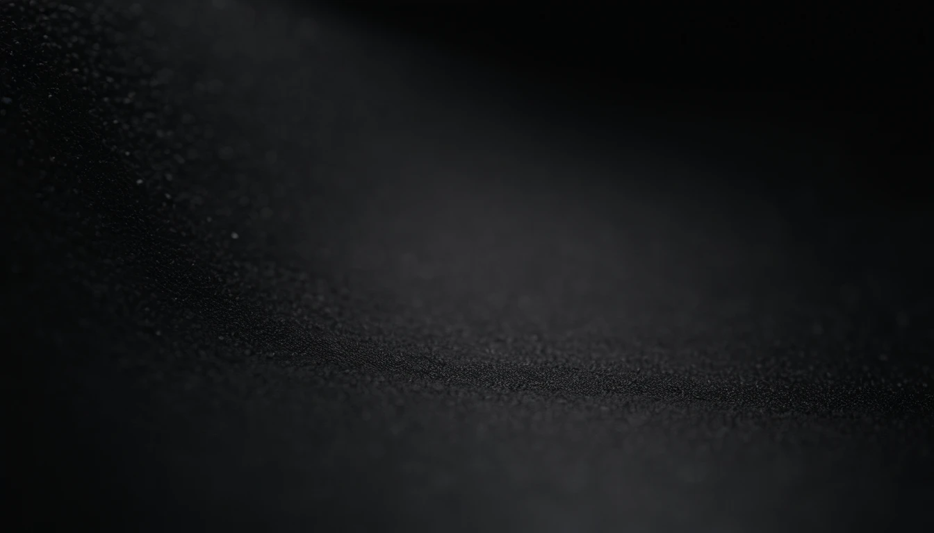 a detailed macro shot of the texture of an empty black wall, focusing on the fine grain and subtle imperfections that give it character and depth