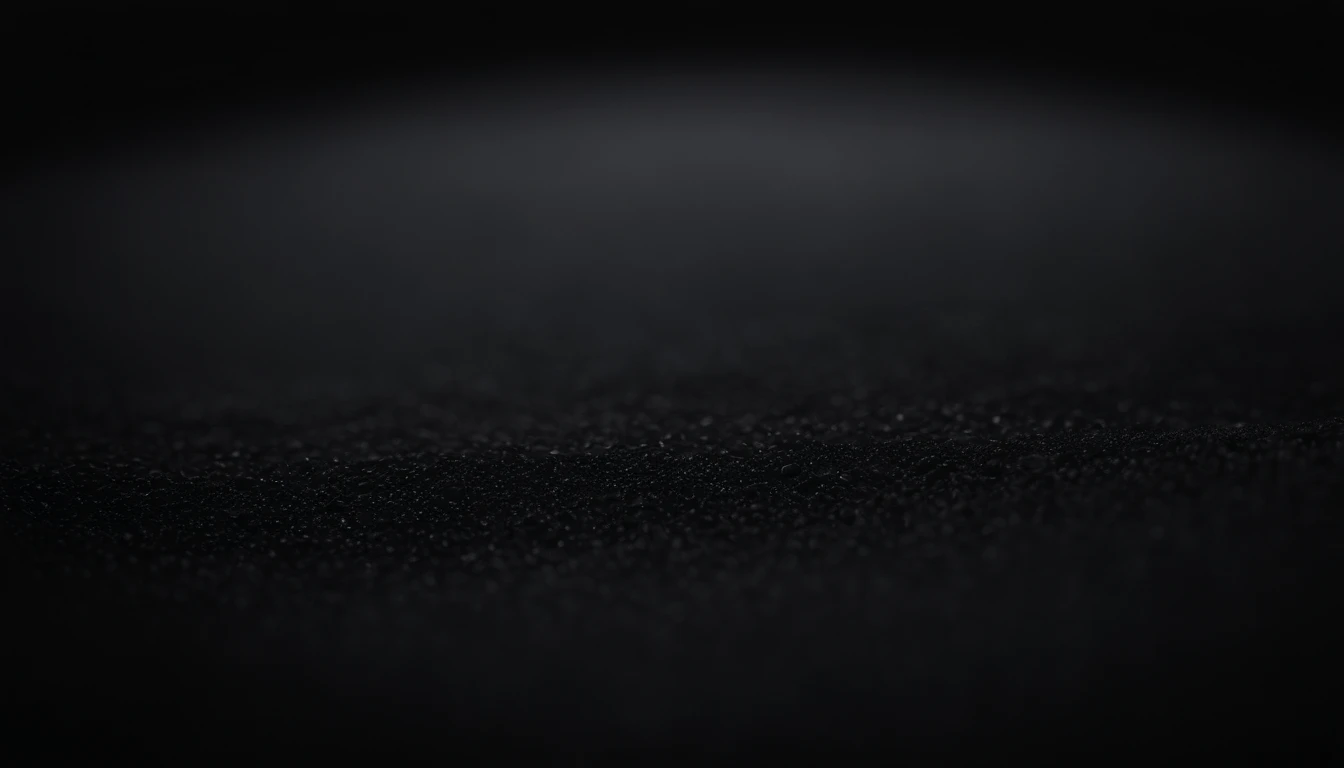 a detailed macro shot of the texture of an empty black wall, focusing on the fine grain and subtle imperfections that give it character and depth