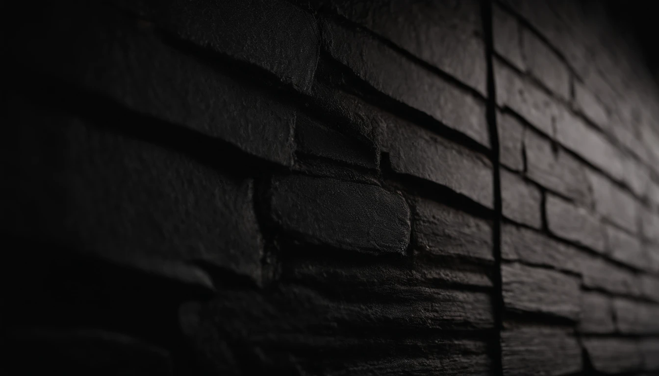 a detailed macro shot of the texture of an empty black wall, focusing on the fine grain and subtle imperfections that give it character and depth